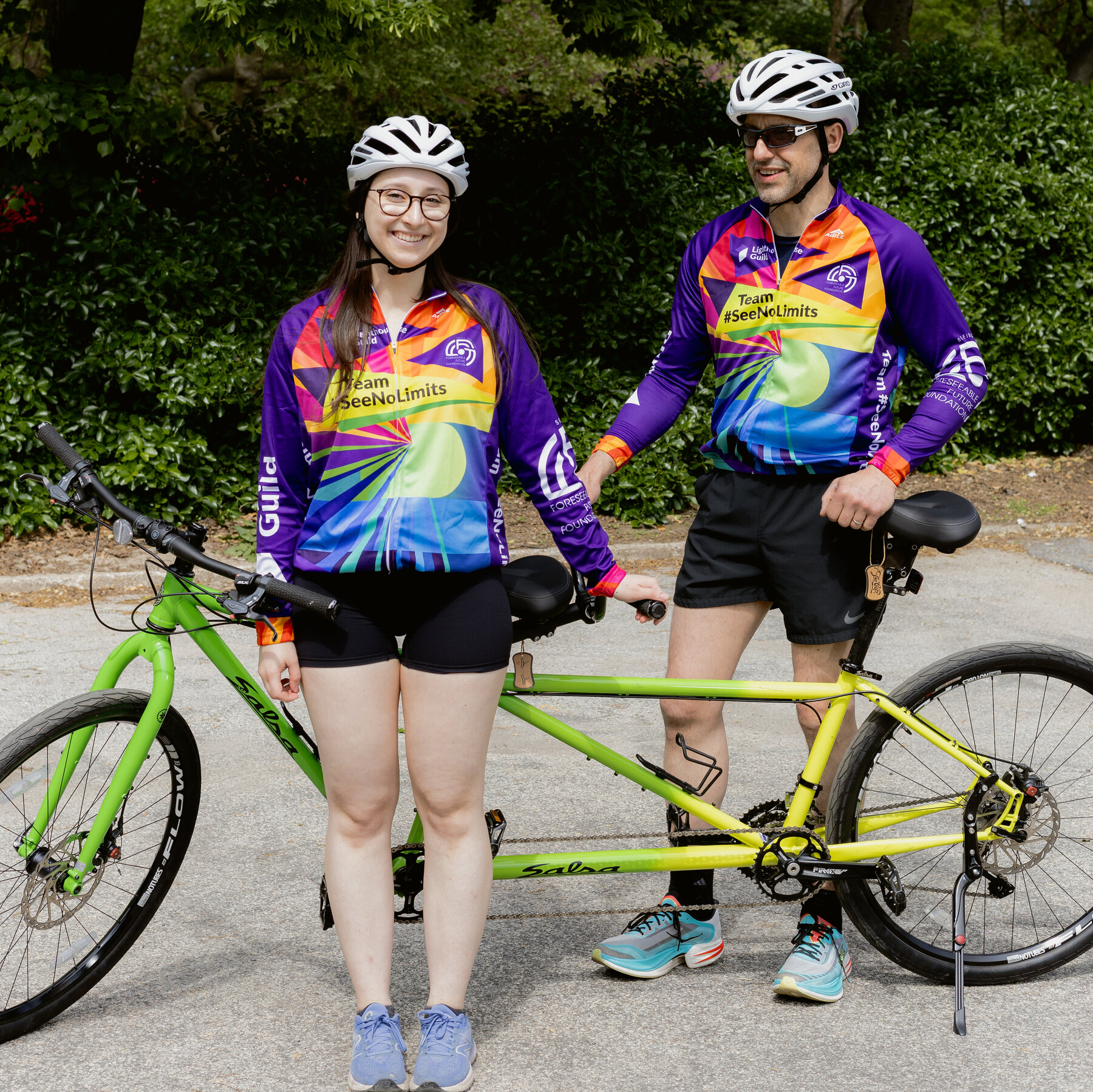 A Blind Bicyclist and His Daughter Work in Tandem