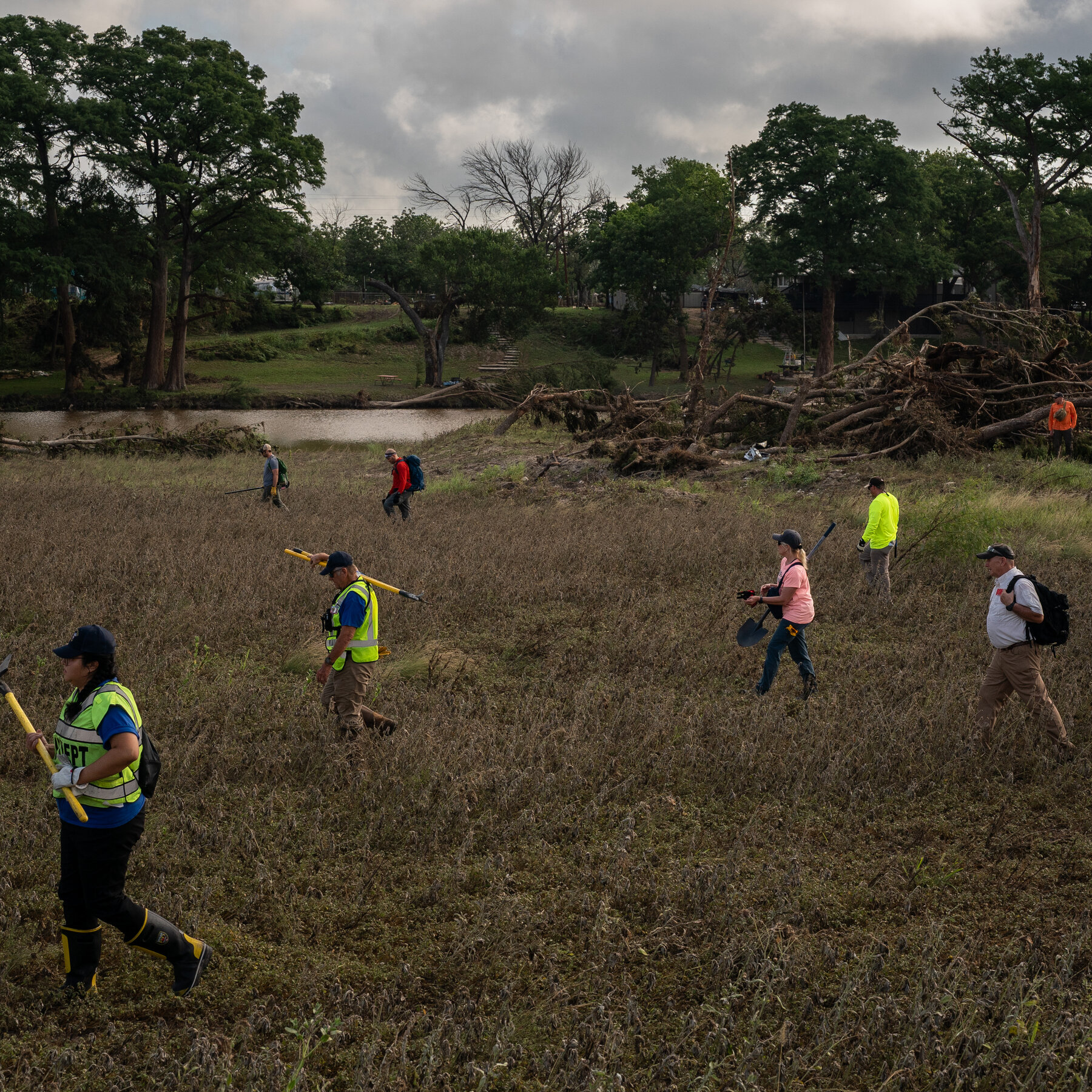 An Army of Searchers Combs the Banks of the Guadalupe for the Missing