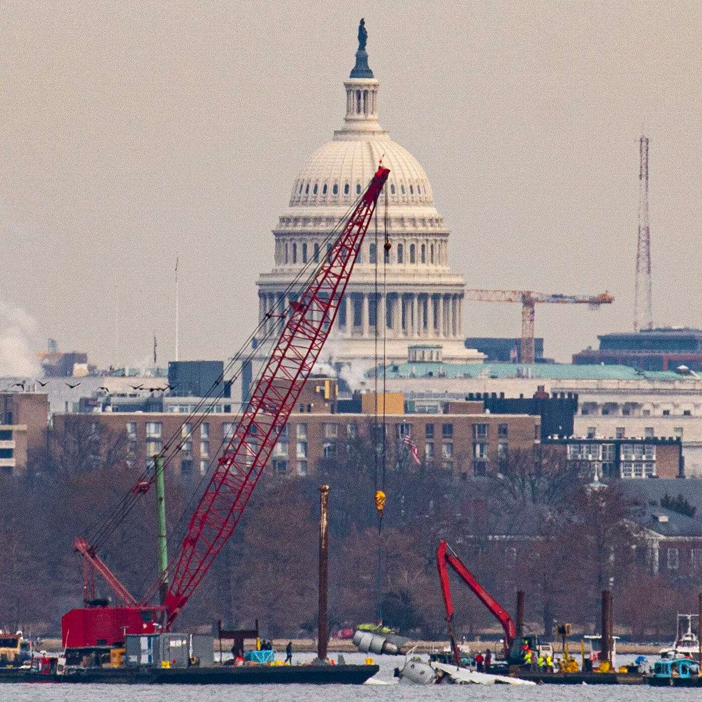 Crews Lift First Wreckage From D.C. Plane Crash Out of Potomac