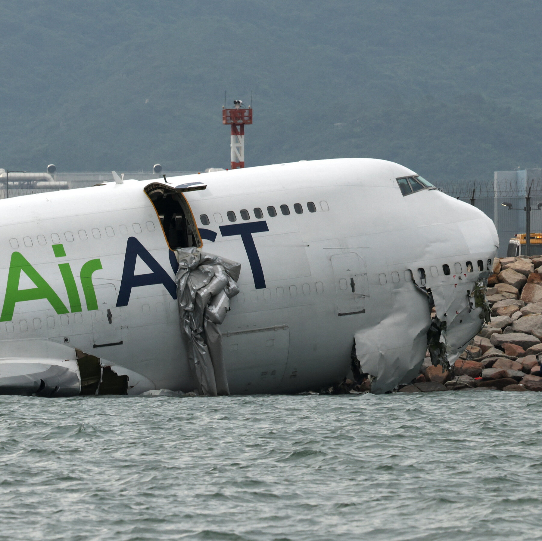 Emirates Cargo Plane Slides Off Hong Kong Runway, Killing 2 Ground Crew