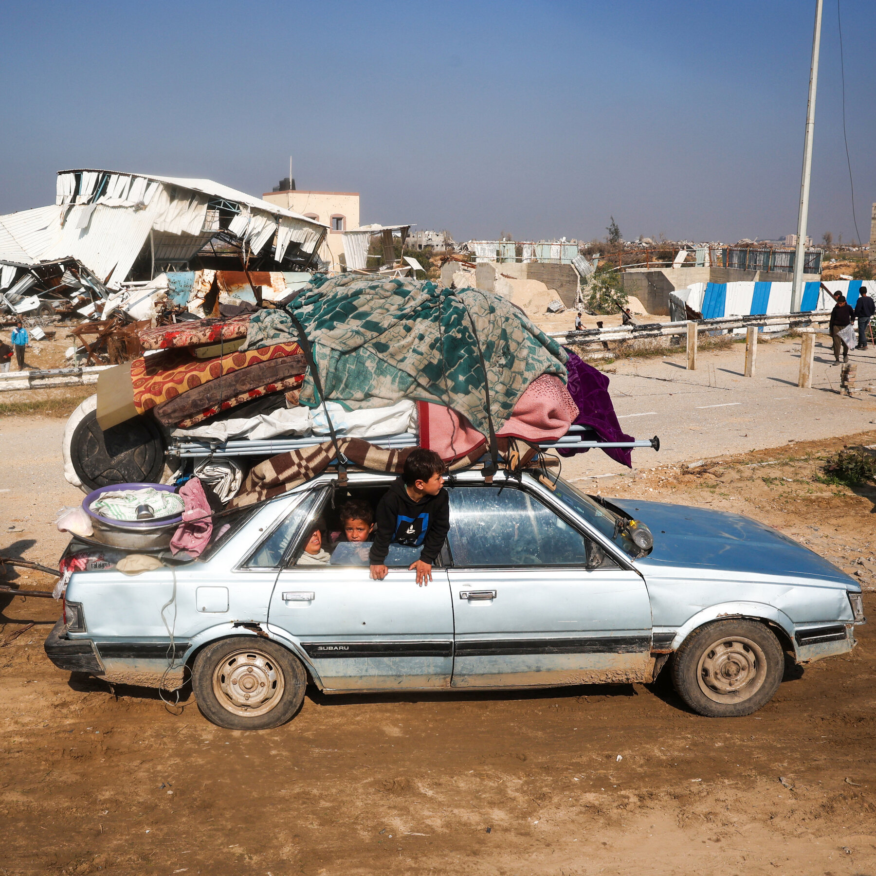 Gazans Crowd the Road North, Joyful but Anxious