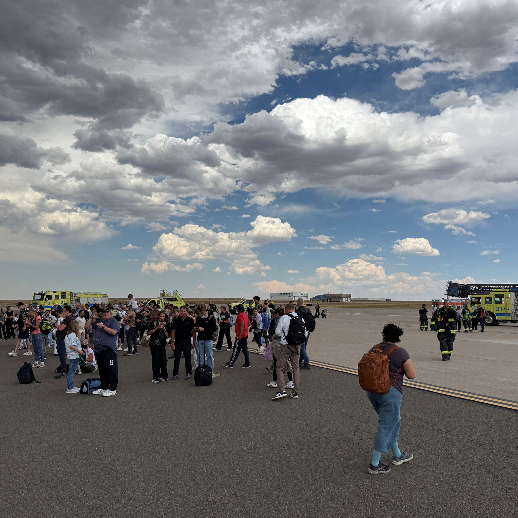 Passengers Evacuate Smoky American Airlines Plane at Denver Airport
