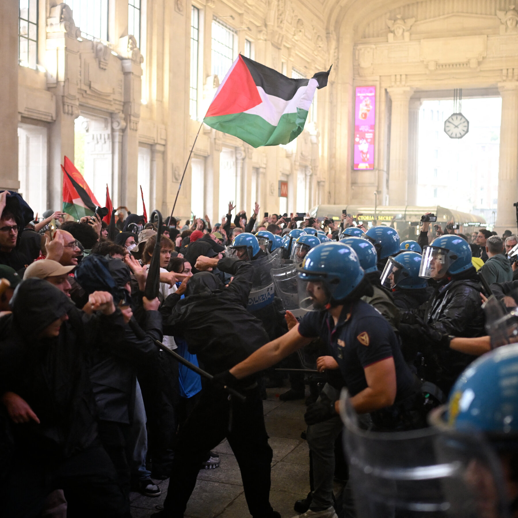 Protesters calling for solidarity with Palestinians clash with the police in Milan.