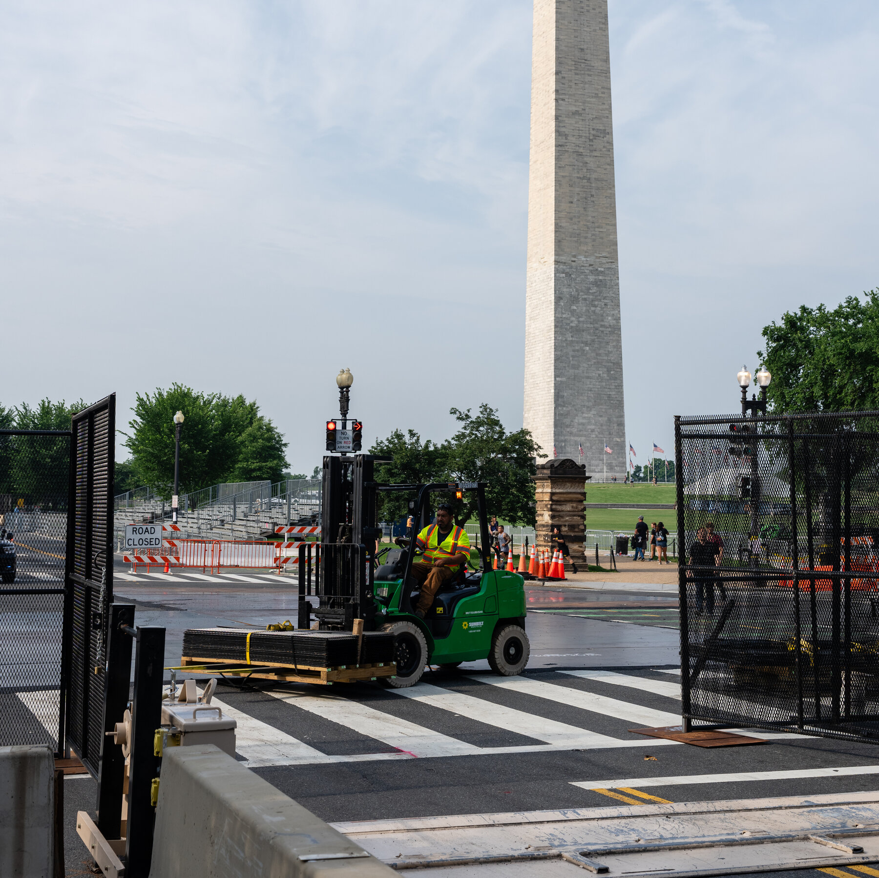 Security for the parade in Washington includes miles of anti-scale fencing.