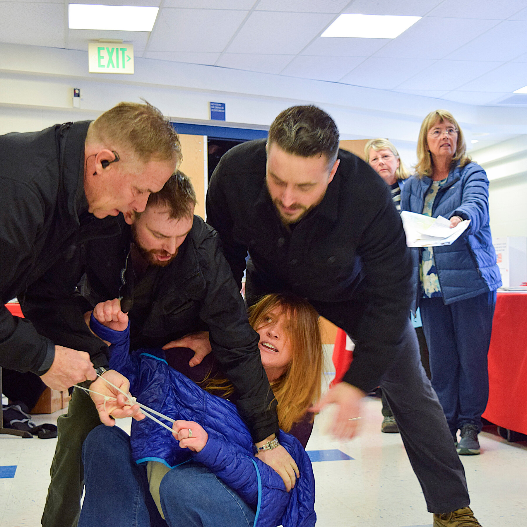 She Interrupted a Town-Hall Meeting and Was Dragged Out by Private Security