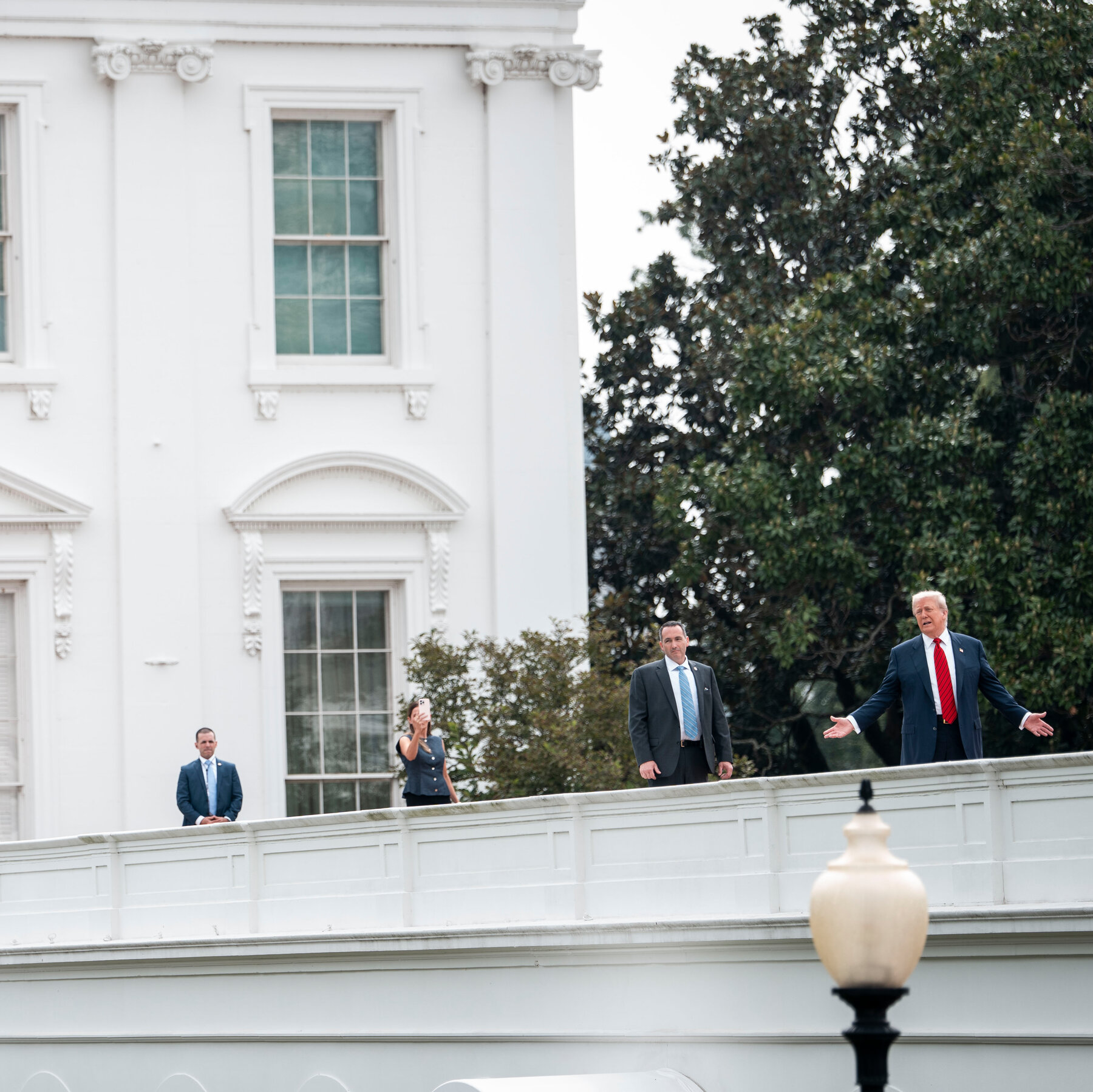 Trump Surveys White House on Morning Roof Stroll