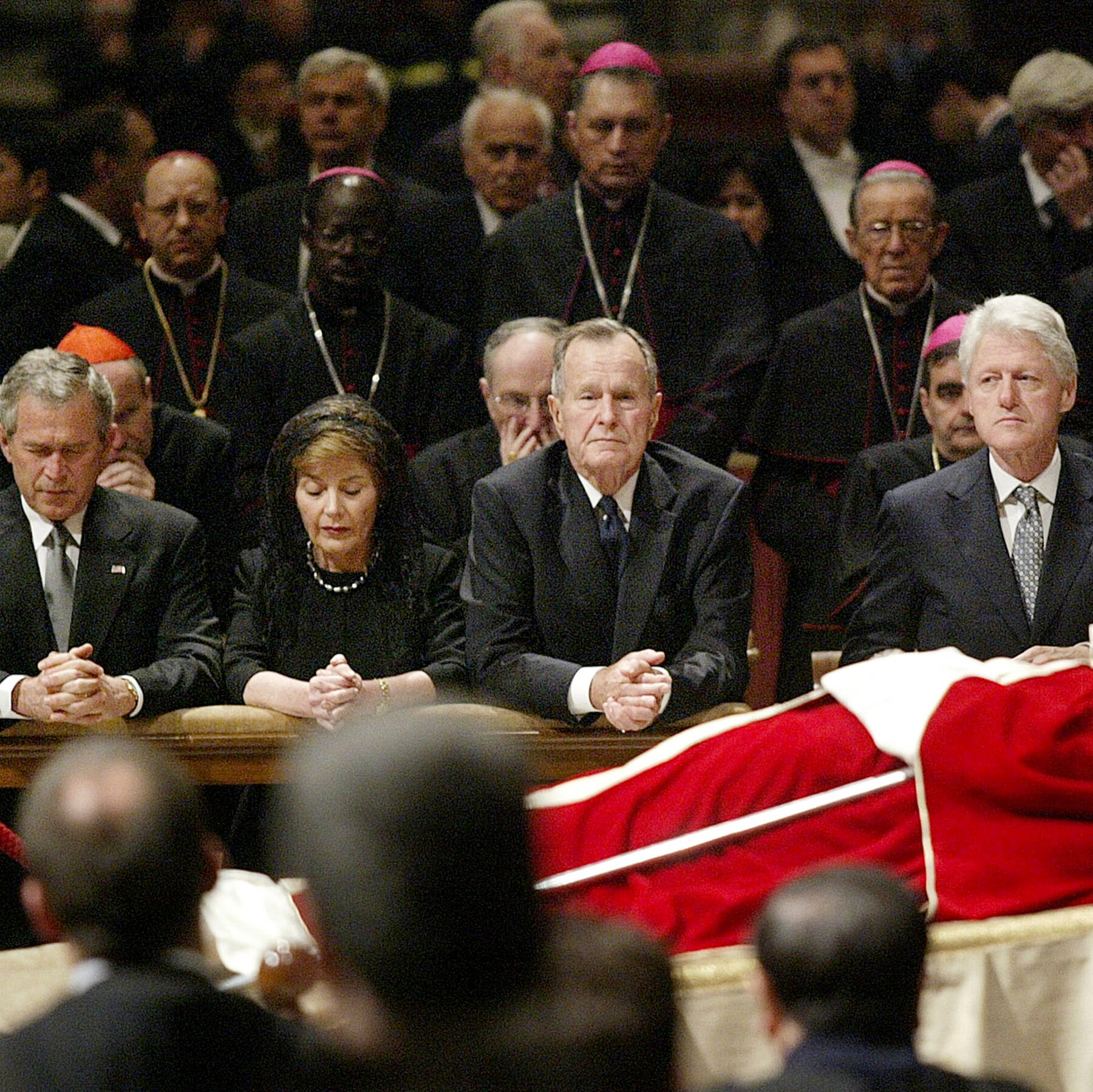 Twenty years ago, three U.S. presidents traveled together to mourn a pope. Not so this time.