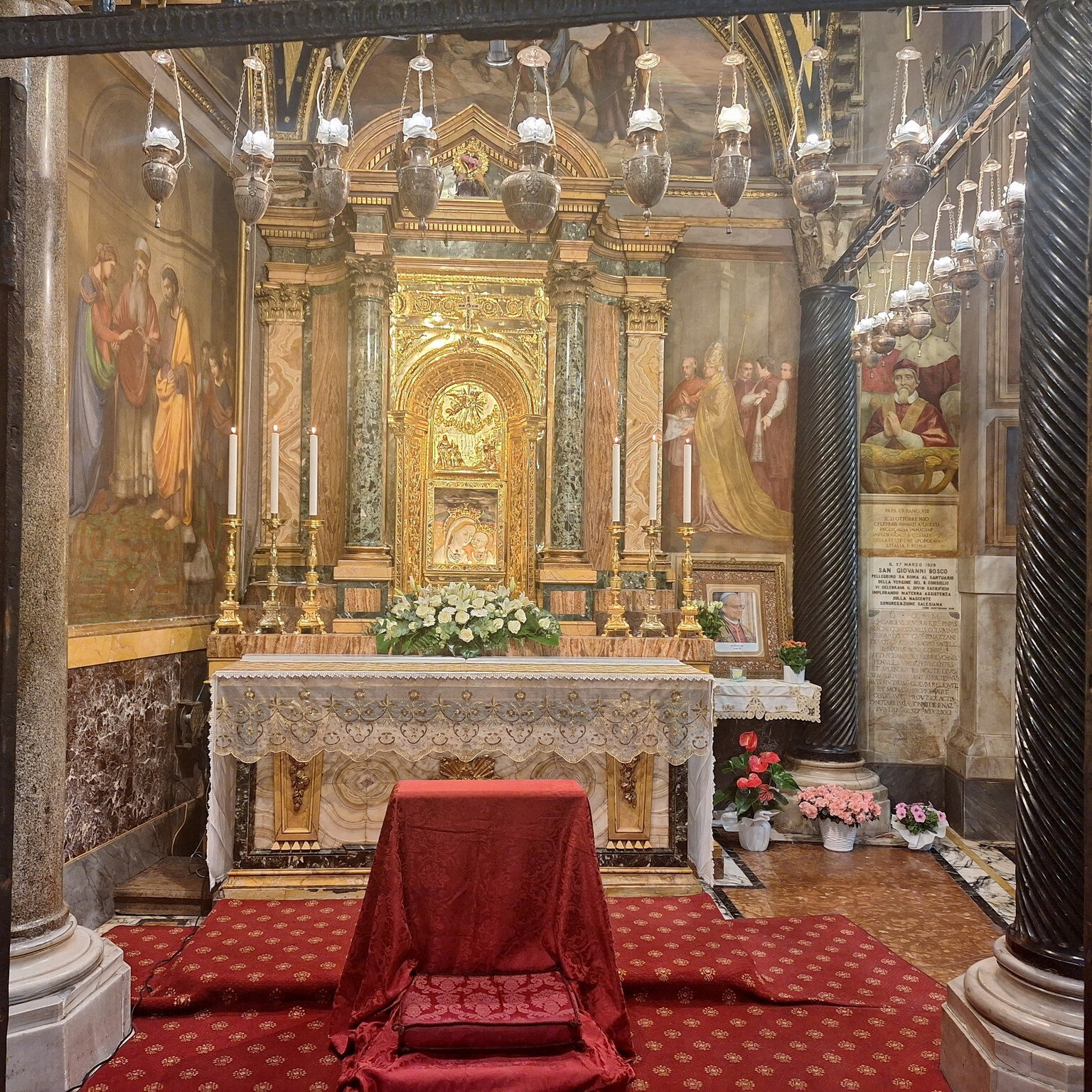 What is the image of the Virgin Mary near the altar?