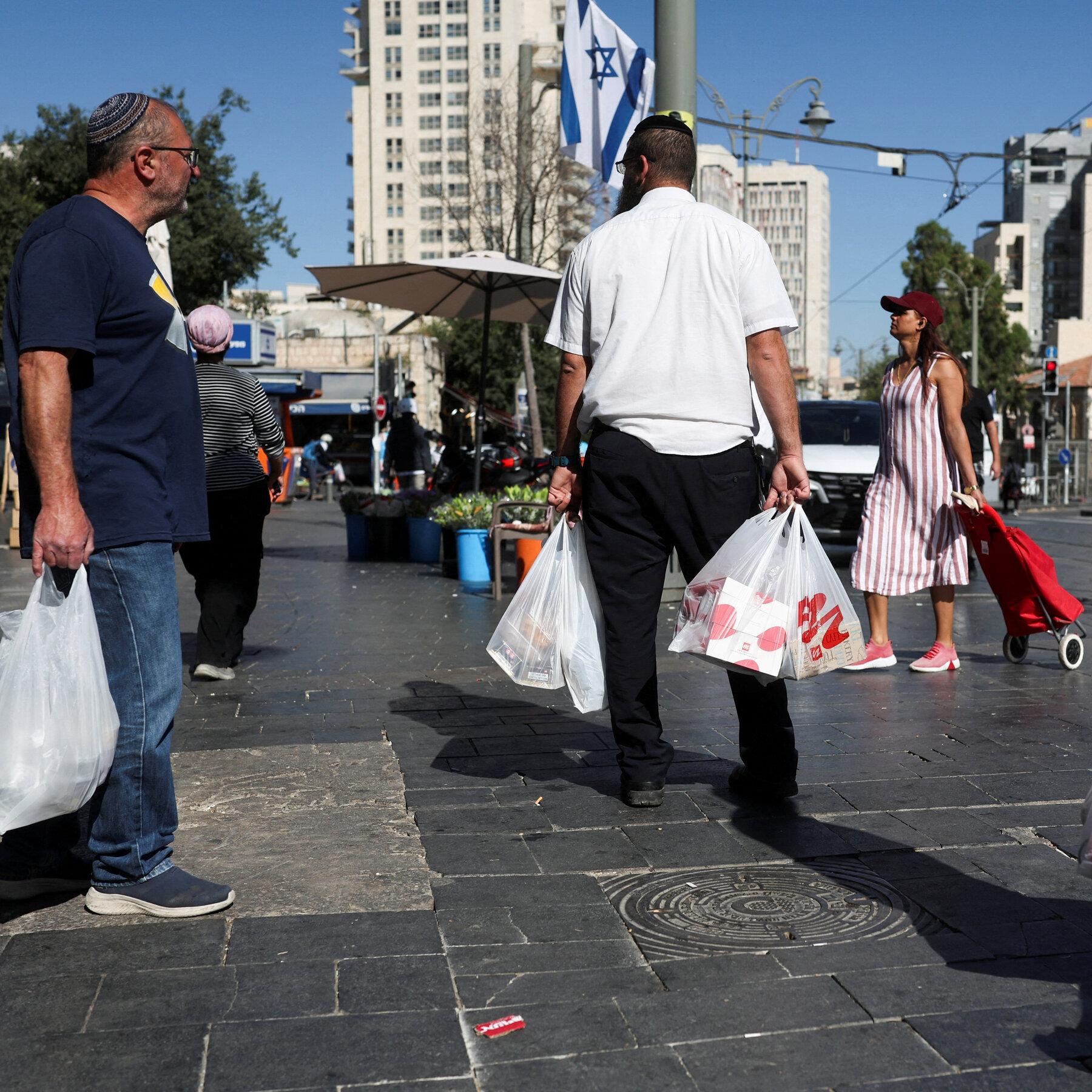 With Iranian drones on the way, Jerusalem residents rush out to shop
